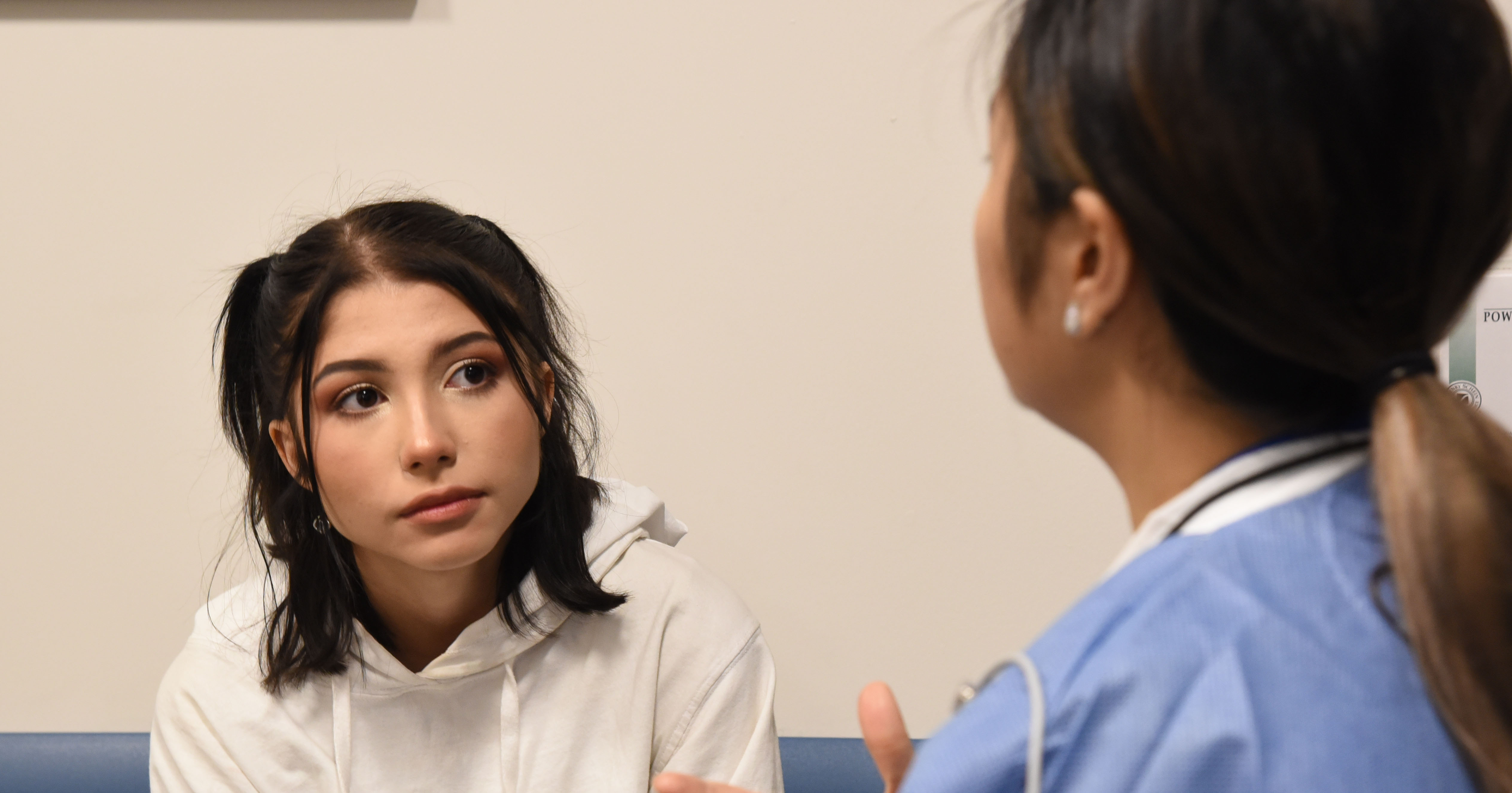 Thornton High School student listens to dental provider.